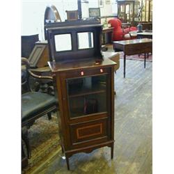 AN EDWARDIAN MAHOGANY MUSIC CABINET, crossbanded and strung, mirror gallery, single glazed door, ...