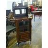 Image 1 : AN EDWARDIAN MAHOGANY MUSIC CABINET, crossbanded and strung, mirror gallery, single glazed door, ...