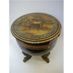 A PAPIER MACHE FUEL BOX, c.1835, kettledrum shape on four scroll feet, the cover with Greek key i...