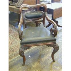 A WILLIAM IV DESK ARMCHAIR, crown back, padded oval splat, acanthus carved scrolled under-arms, s...