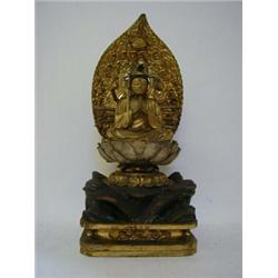 A CHINESE TABLE TOP SHRINE, 19th Century, the tabernacle black laquered, gilt interior, twin door...
