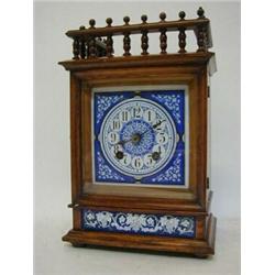 AN AESTHETIC MOVEMENT OAK BRACKET TIMEPIECE, c.1880, spindle gallery, blue and white enamel Arabi...