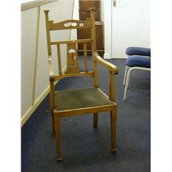 A SET OF THREE ARTS AND CRAFTS OAK CHAIRS, c.1900, (one armchair) tall uprights, pieced top rail ...