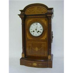 AN EDWARDIAN MAHOGANY MANTEL CLOCK, arched architectural case with extensive inlay of swags, stri...