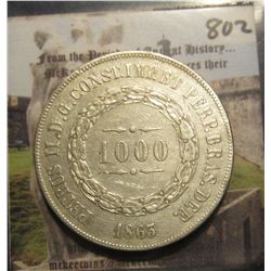 802. 1863 Brazil .917 Fine Silver 1000 Reis. AU 50. KM # 465.