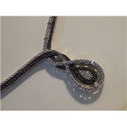 NECKLACE - BLACK AND WHITE INTERTWINED NECKLACE - .25CARAT - 25 DIAMONDS TTL - RETAIL ESTIMATE $650