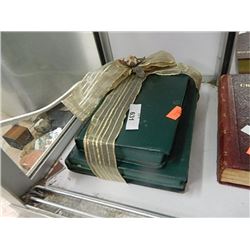 Set of green vintage books with ribbon