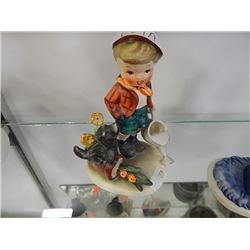 little boy wiht watering can