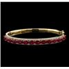 Image 1 : 7.28ctw Ruby and Diamond Bangle Bracelet - 14KT Yellow Gold