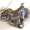 Image 1 : Keith Christie (b.1940). Bronze sculpture. Saddle. #31/50. 5" x 8" x 10". Estimate $400-$500.…