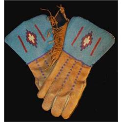 Blackfeet Indian Beaded Gauntlets. Blue background, circa 1900. Good condition. Estimate $750-$1,…