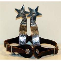 Silver Overlaid Cowboy Spurs. Estimate $300-$400.…