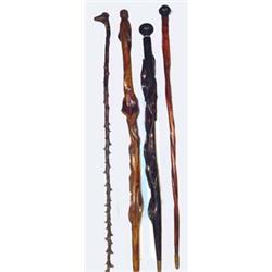 4 Antique Northern Plains  Indian Canes. Fine condition. 36" long. Estimate $400-$500.…