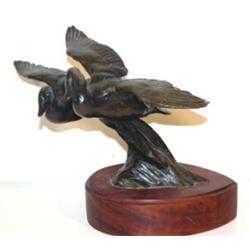 Tom Sander (b.1938). Bronze sculpture. Flying Ducks. 8" x 10.5". Estimate $600-$800.…