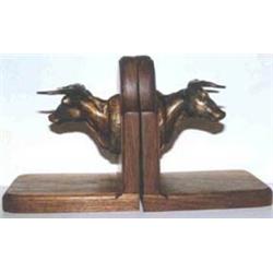 C.M. Russell (1864-1926). Bronze bookends. Steer heads. #136 & 137/150. 4" x 4". Estimate $600-$8…