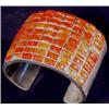 Image 1 : Silver Cuff Bracelet With 72 Coral Stones. Estimate $600-$1,000.…