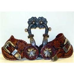 Early California Style Spurs. Silver inlaid with tooled straps. Fine condition. Estimate $750-$1,…