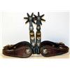 Image 1 : Texas Style Spurs. Unmarked. Silver mounted & engraved. Newer straps. Estimate $750-$1,000.…