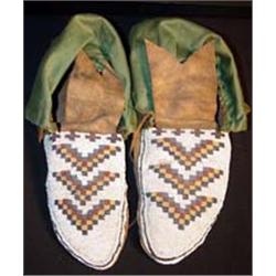 Blackfeet Indian Beaded Moccasins. Stiff. Beadwork in fine condition. Estimate $500-$750.…