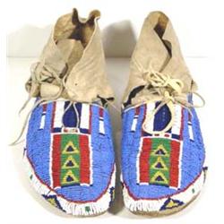 Northern Plains Fully Beaded Moccasins. 10" long. Excellent condition. Estimate $1,000-$1,500.…