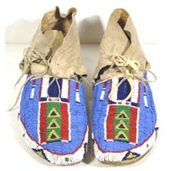 Northern Plains Fully Beaded Moccasins. 10  long. Excellent condition. Estimate $1,000-$1,500.…