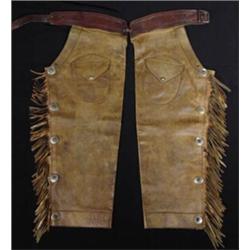 Early Shotgun Chaps with nice fringe & conchos. Fine Condition. No maker. Estimate $800-$1200.…