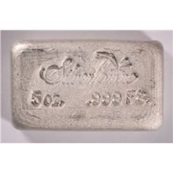 A FIVE OUNCE SILVERTOWNE .999  SILVER POURED BAR