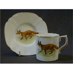 A ROYAL CROWN DERBY COFFEE CAN AND SAUCER, 20th Century, each decorated with a fox, signed 'C. Gr...