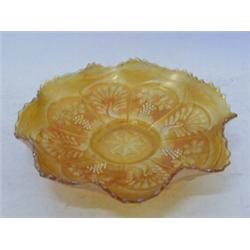 A MARIGOLD CARNIVAL GLASS DISH, moulded Peacock and Grape pattern, diameter 22cm  £30-50...