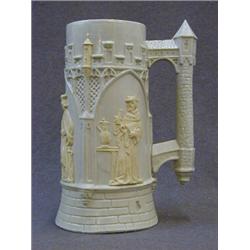 A GOTHIC STONEWARE JUG, mid 19th Century, olive coloured, moulded medieval figures in lancet open...