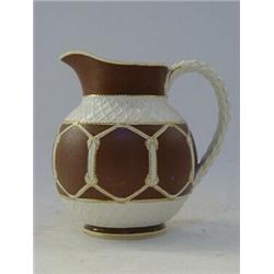 A SALT GLAZED STONEWARE JUG, 19th Century, moulded balloon cord on a textured brown and white gro...