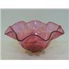 Image 1 : A RUBY GLASS BOWL, wavy rim, clear pincered base, pontil mark, diameter 23cm  £30-50...