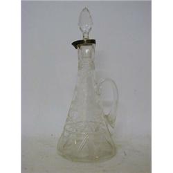 AN ART NOUVEAU CLARET JUG, clear wheel cut tendrils and florets on tapered body, silver collar ri...