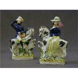 A PAIR OF STAFFORDSHIRE FLATBACK FIGURES, mid 19th Century, Queen Victoria and Prince Consort on ...