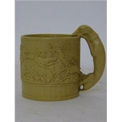 A STAFFORDSHIRE SALTGLAZE HUNTING MUG, 19th Century, drab body, greyhound handle, height 11cm  £2...