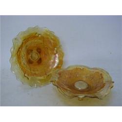 TWO MARIGOLD CARNIVAL GLASS DISHES, thistle pattern on four feet, diameters 21cm (2)  £20-40...