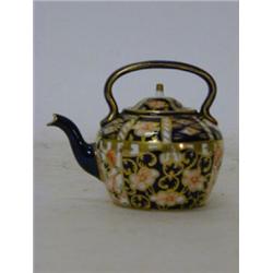 A ROYAL CROWN DERBY MINIATURE TEAPOT, Imari pattern 1479, date cypher 1919, height 6cm  £50-80...