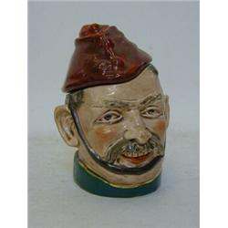 A NOVELTY TOBACCO JAR, early 20th Century, formed as a moustached gentleman wearing a forage cap,...
