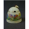 Image 1 : A CLARICE CLIFF HONEY POT AND COVER, transferred floral pattern, bee finial, height 10cm  £30-40...