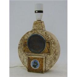 A TROIKA CIRCULAR LAMP BASE, (believed to be marked R.G.B), with shade, height 21cm  £100-120...