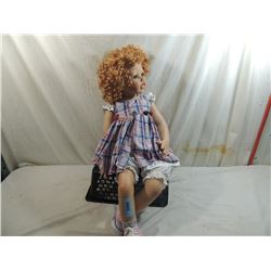 SEATED DOLLMAKER DOLL