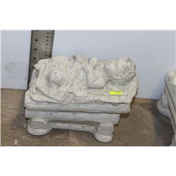 CONCRETE BOY IN CRADLE