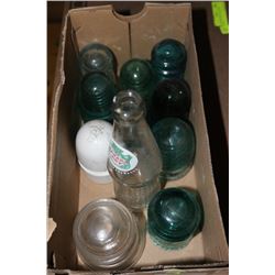 BOX OF 10 INSULATORS AND 1 EMPTY BOTTLE OF BEER