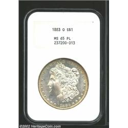 1883-O S$1 MS65 Prooflike NGC. Reflective fields sparkle against the frosty devices, and experienced