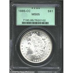 1885-CC S$1 MS65 PCGS. Mostly sharp in detail, the richly frosted surfaces are devoid of even the li