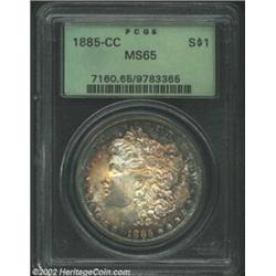 1885-CC S$1 MS65 PCGS. Mottled sea-green, gold, steel-gray, and steel-blue toning with full underlyi