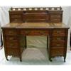 Image 1 : A Victorian carved mahogany breakfront pedestal kneehole writing desk, the upper section with pie...