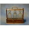 A late Victorian oak tantalus complete with 3 cut glass bottles £60-90...