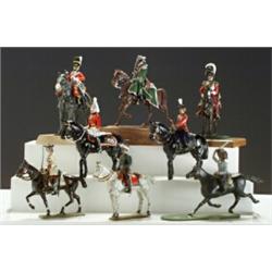 Group of Nine Mounted Figures, 20th Century, Including Queen Elizabeth II and various royal g...