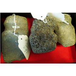 Three grooved stone tools